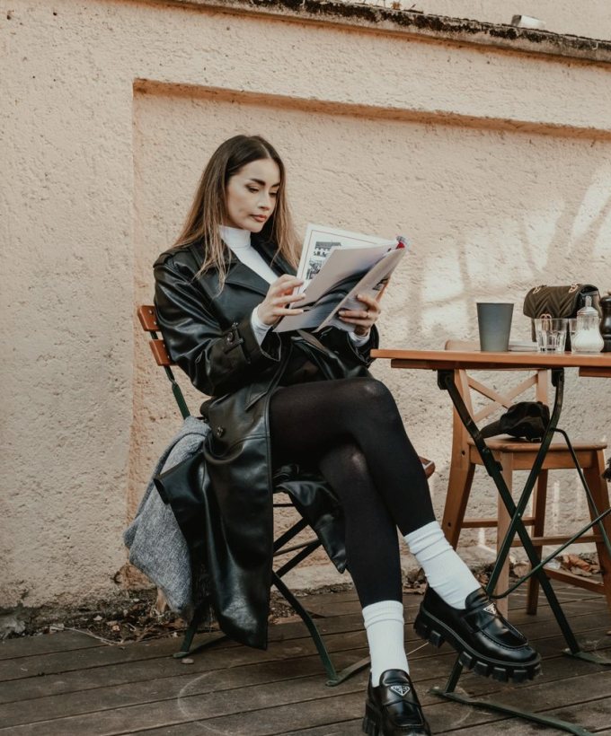 Reader with a magazine in a cafe